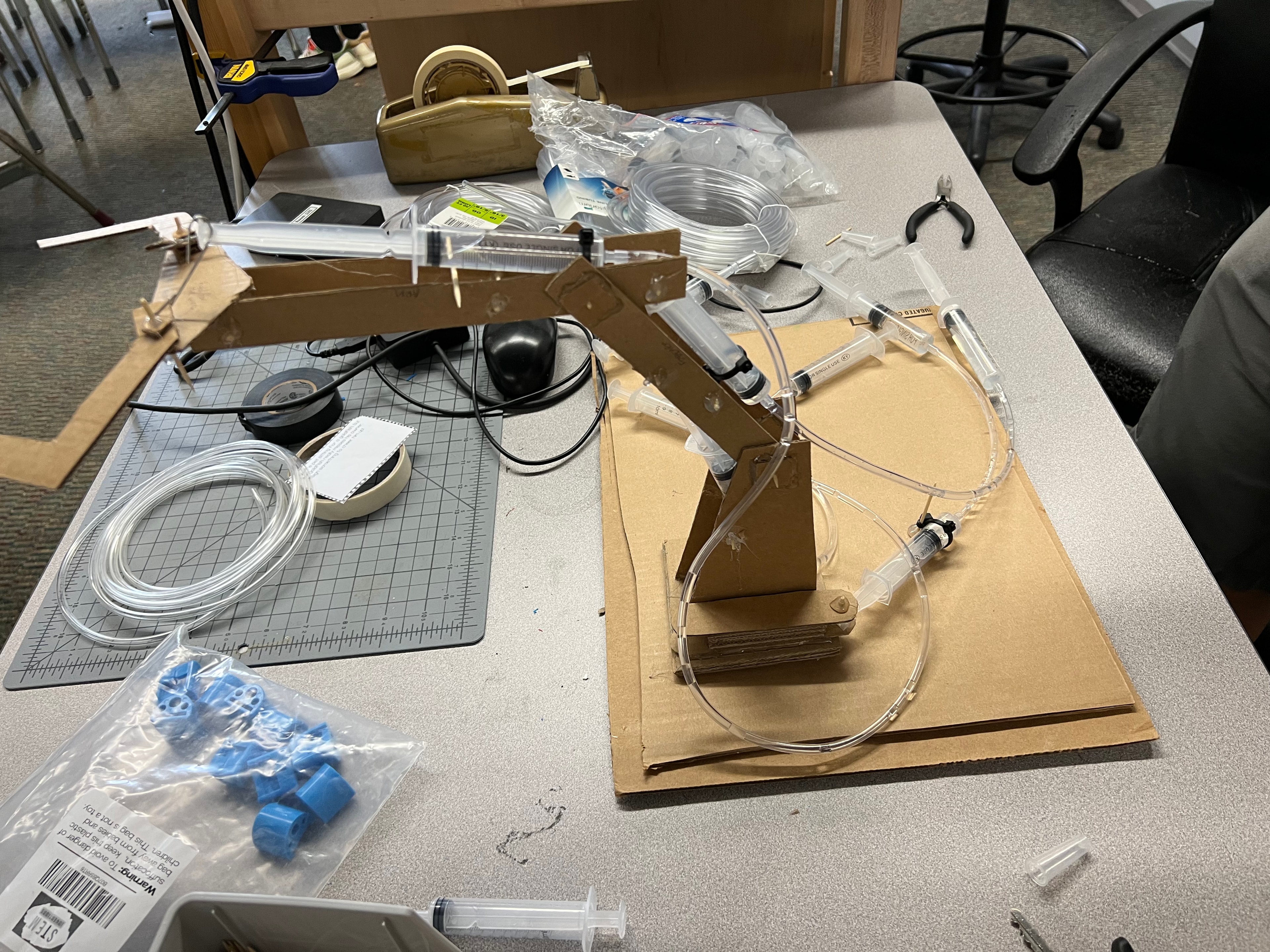 Students building cardboard electronics projects