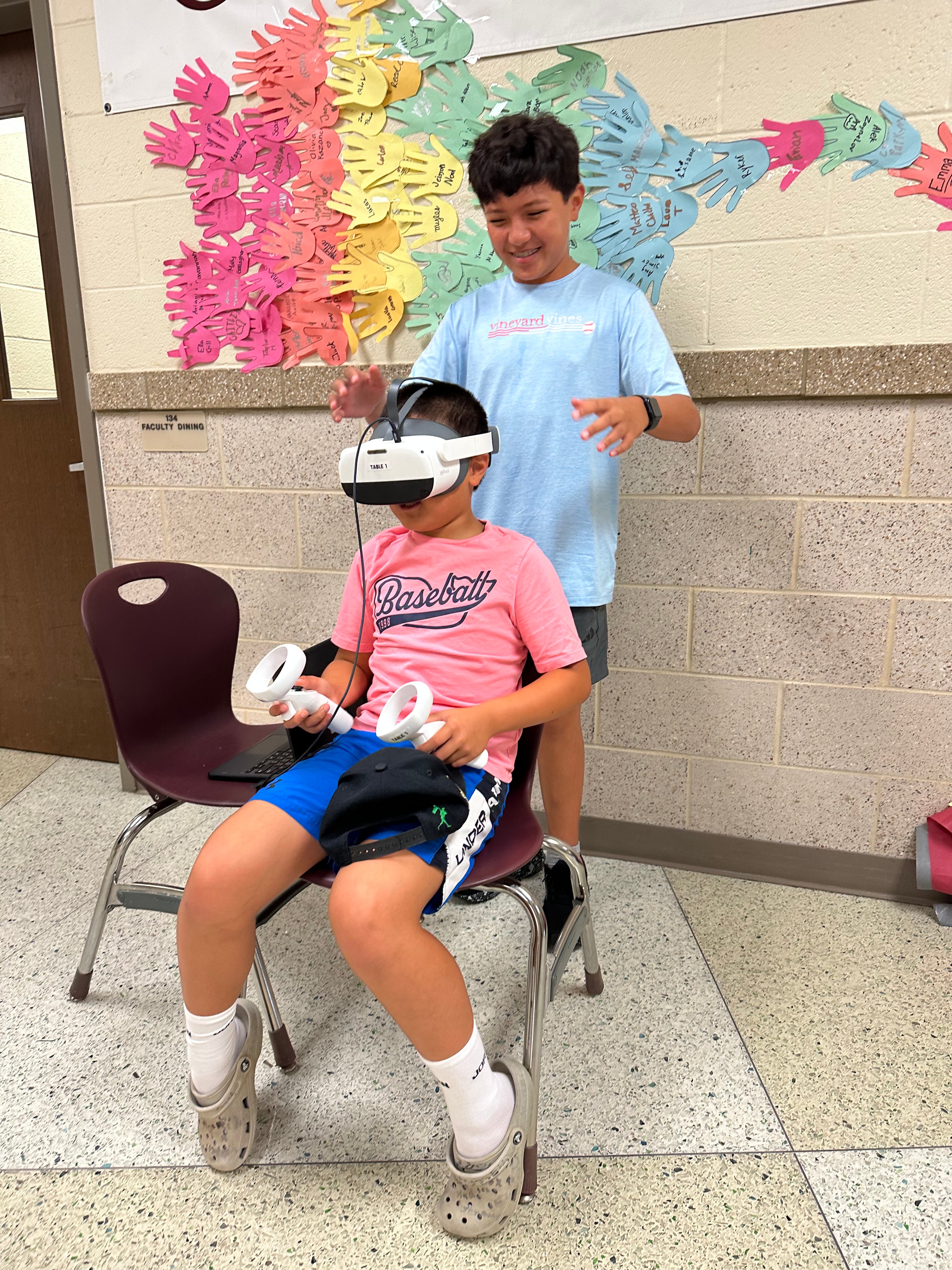 Students exploring virtual reality together during a STEM activity